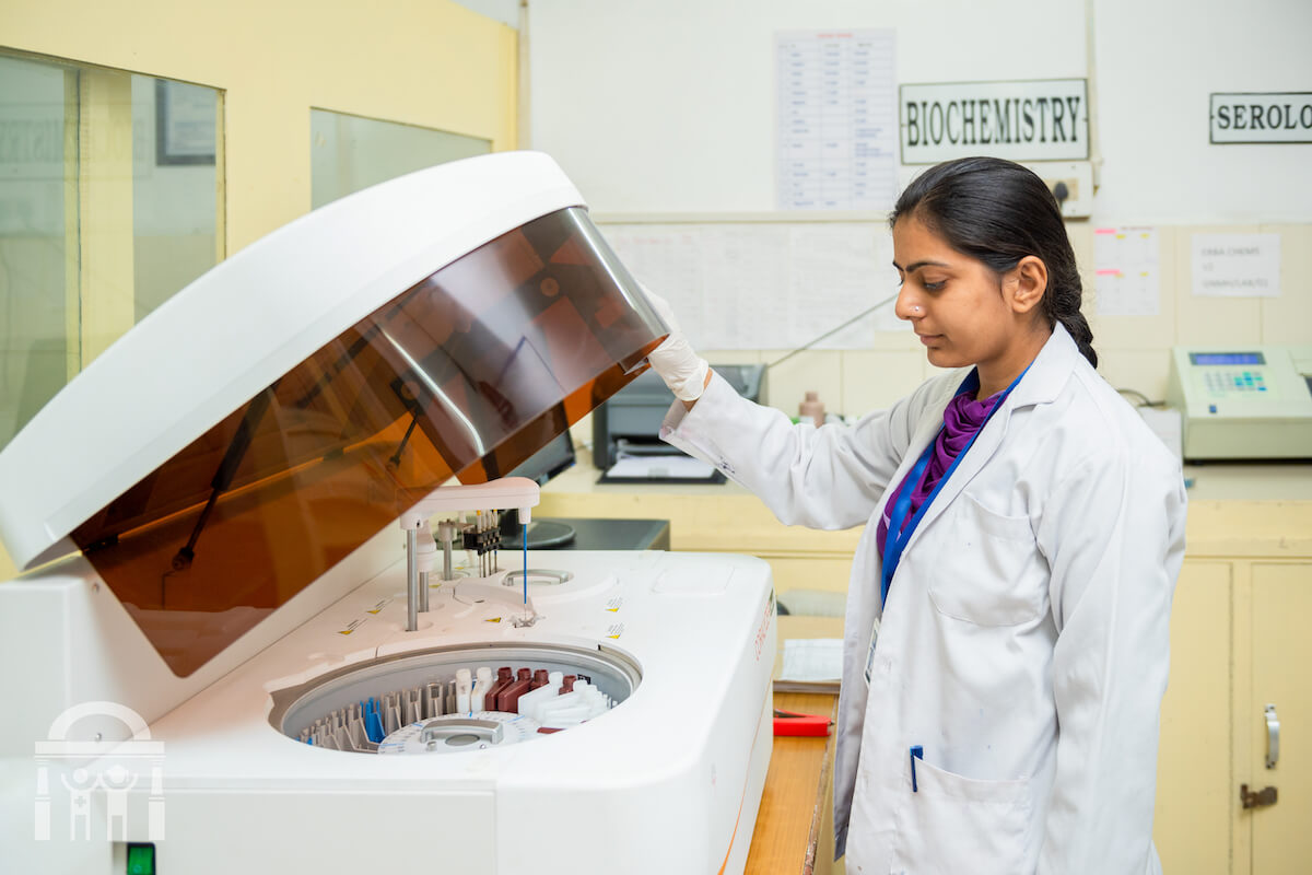 lab technician operating a centrifuge in a pathology lab at Guru Nanak Mission Hospital near Banga, Punjab