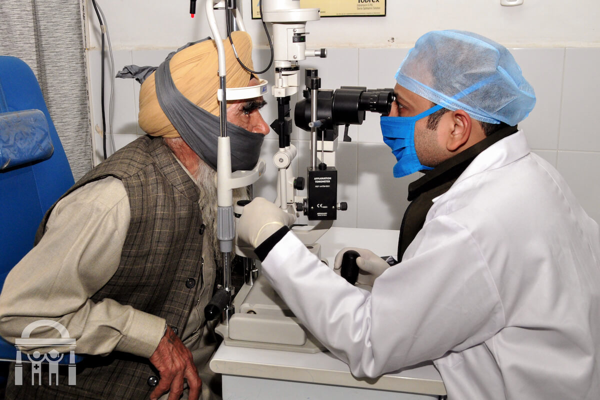 Ophthalmologist giving eye checkup to patient at Guru Nanak Mission Hospital in Dhahan Kaleran near Banga in Shaheed Bhagat Singh Nagar district