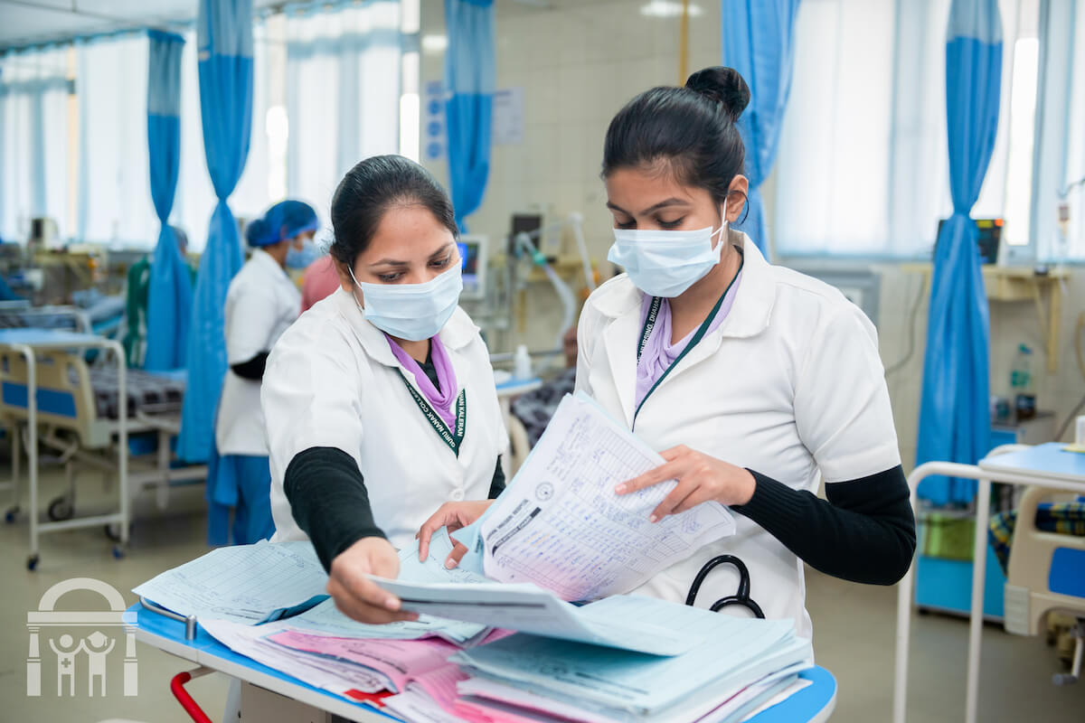 Nurses organizing and reviewing paperwork at Guru Nanak Mission Hospital in Dhahan Kaleran near Banga in Shaheed Bhagat Singh Nagar district