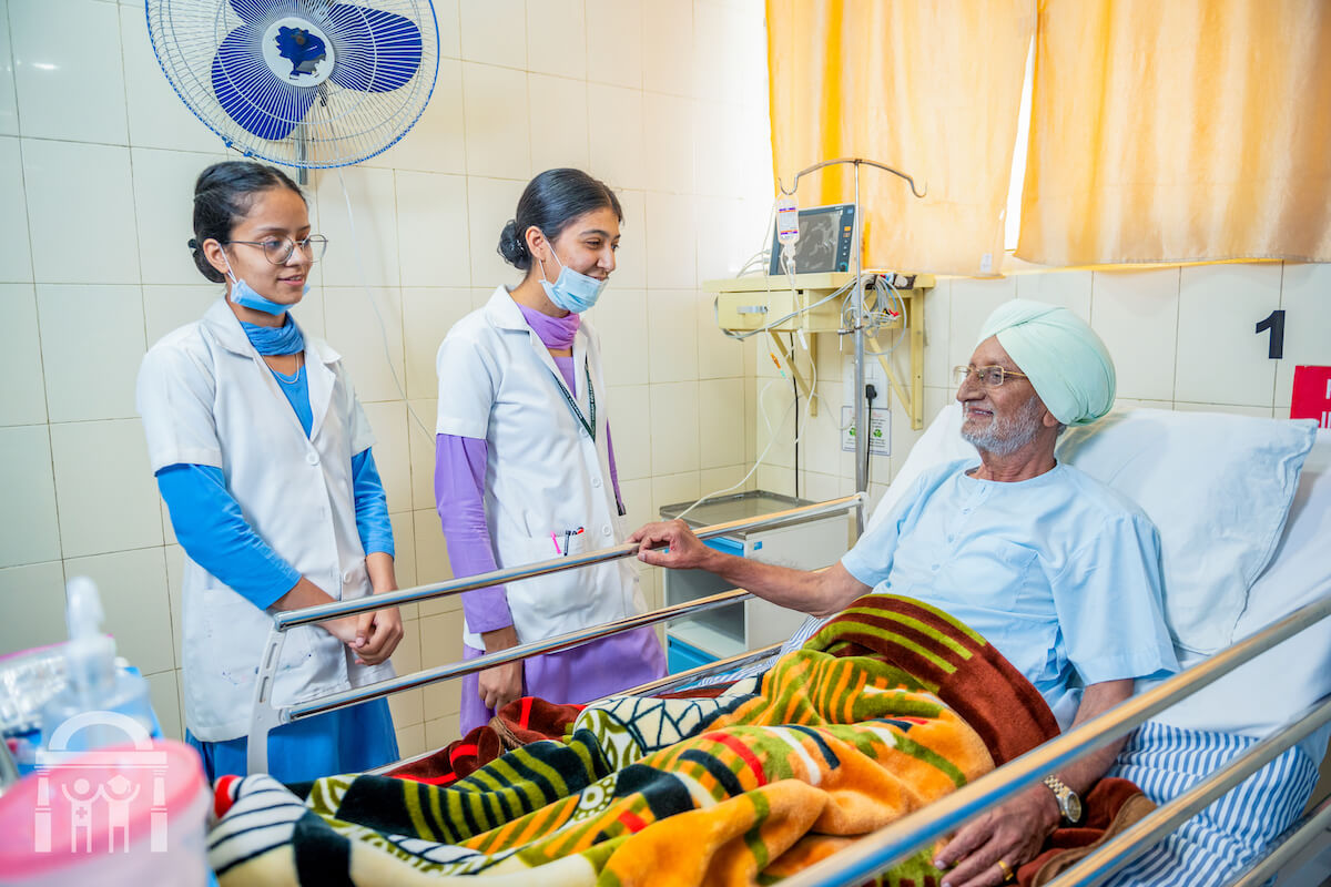 Nurses and patient happy in emergency ward at Guru Nanak Mission Hospital Dhahan Kaleran near Banga