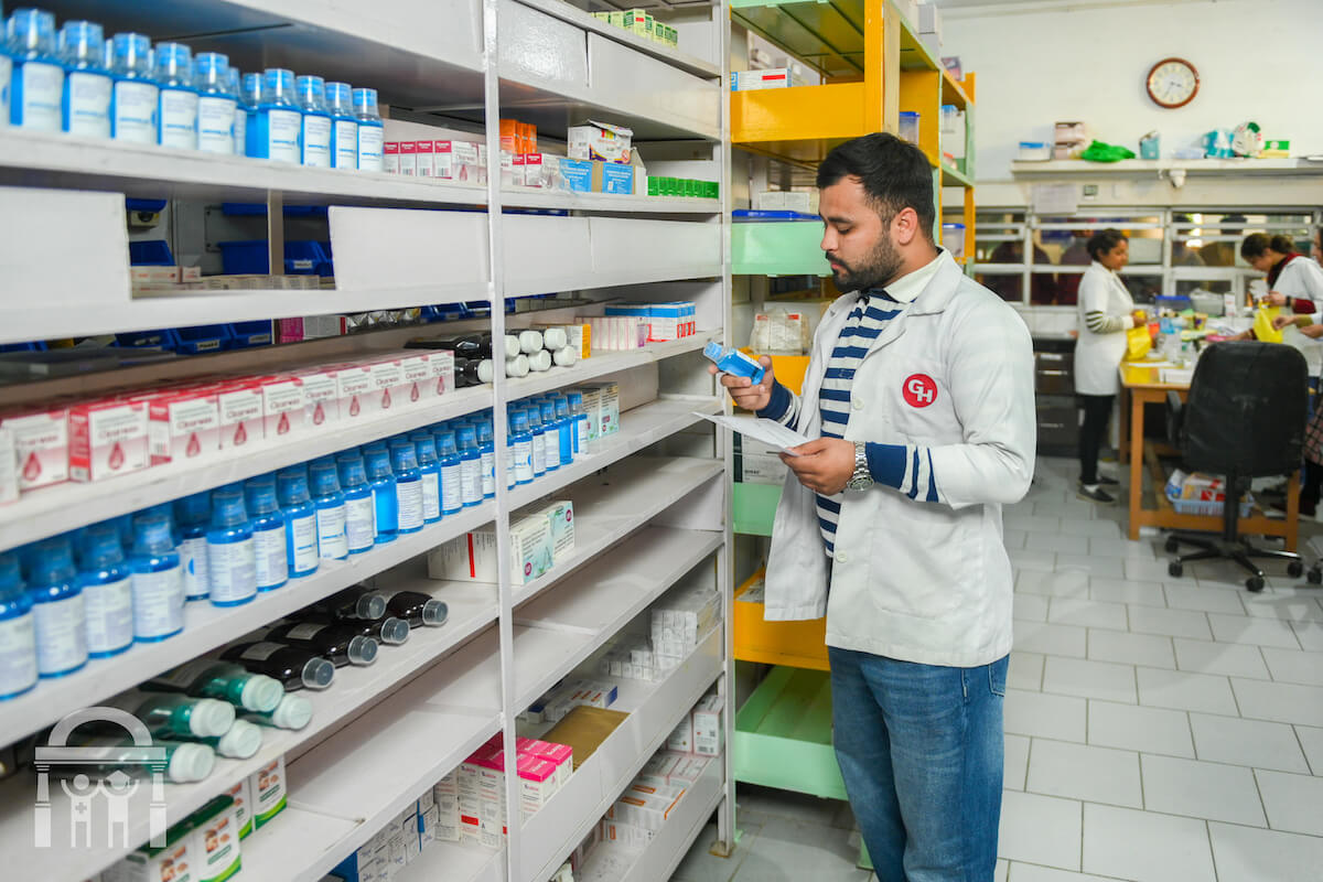 Pharmacist picking medications at pharmacy at Guru Nanak Mission Hospital Dhahan Kaleran near Banga