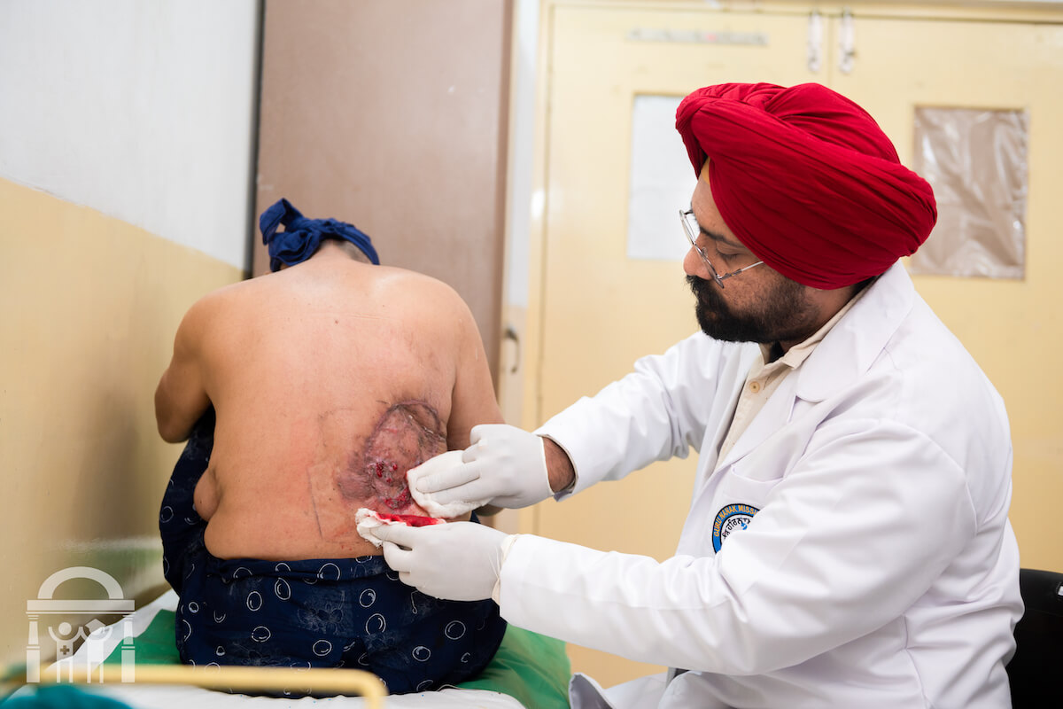 General surgeon dressing a wound at Guru Nanak Mission Hospital in Dhahan Kaleran near Banga in Shaheed Bhagat Singh Nagar district