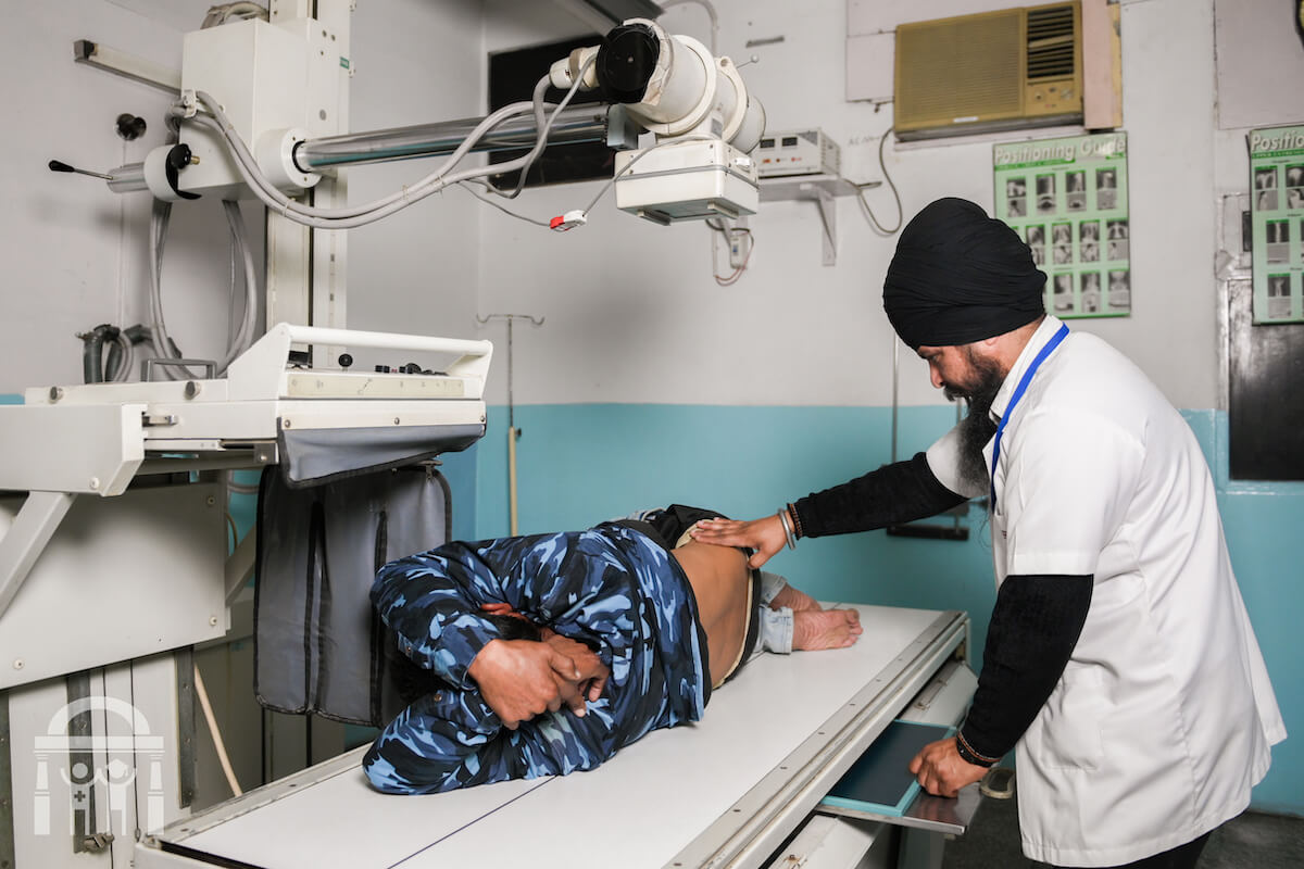 X-ray scan with patient and technician at Guru Nanak Mission Hospital Dhahan Kaleran